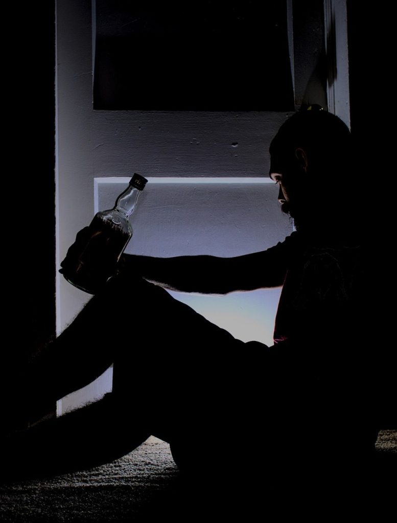 Drinking alone man bottle