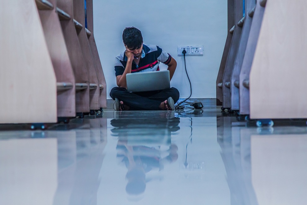 Young Man Studying In Library