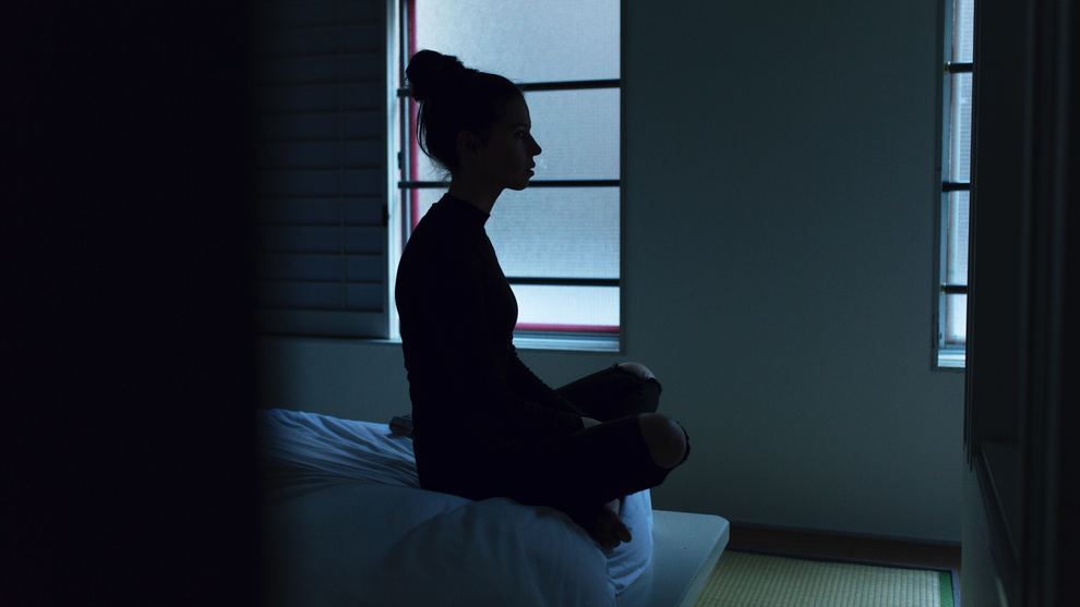 Woman Sitting on Bed Silhouette