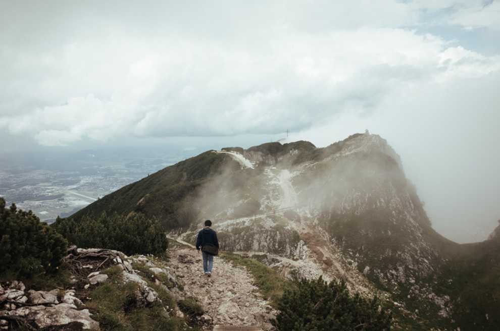 man mist mountain path