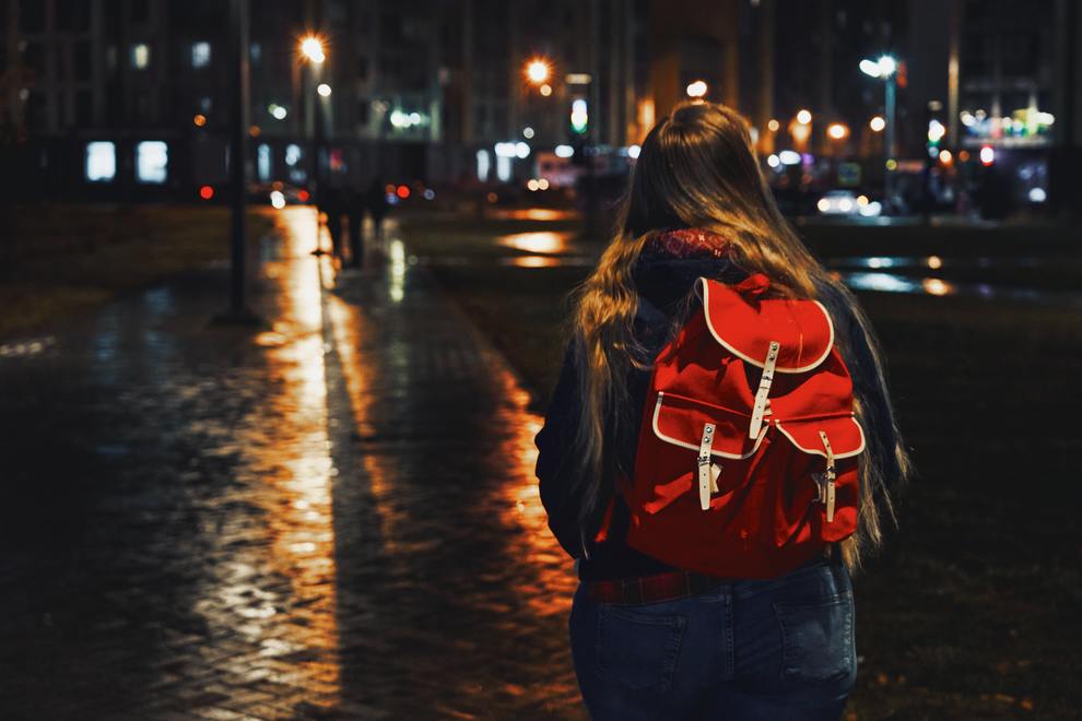 girl backpack night city from behind