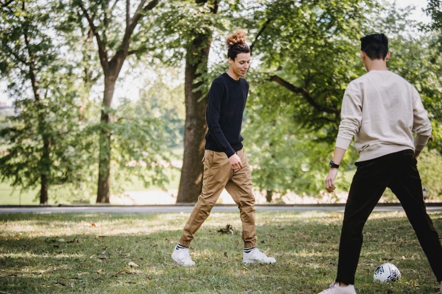 boys playing kick ball