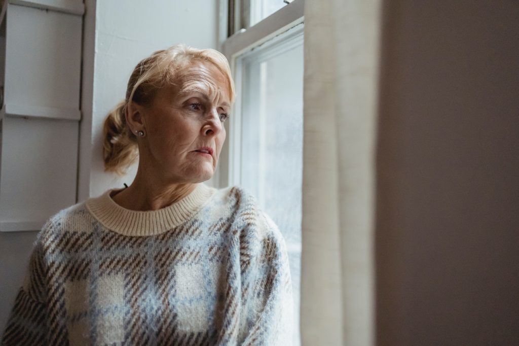 woman looking out the window