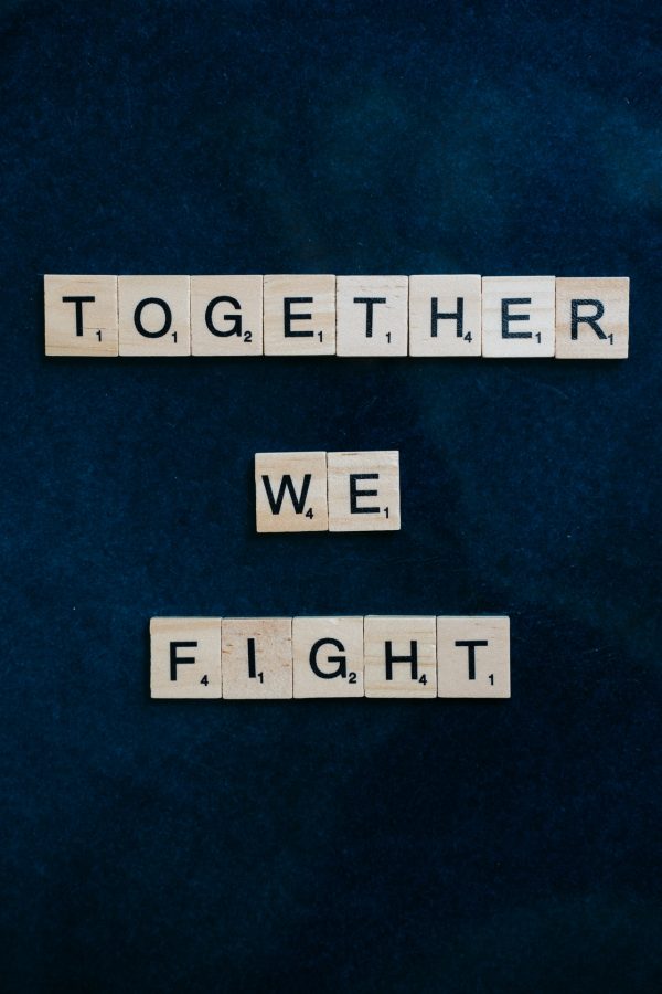 together we fight on scrabble tiles
